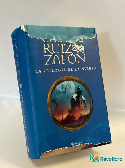 Portada de La trilogía de la niebla - 1ª edición de Carlos Ruiz Zafón, libro de segunda mano