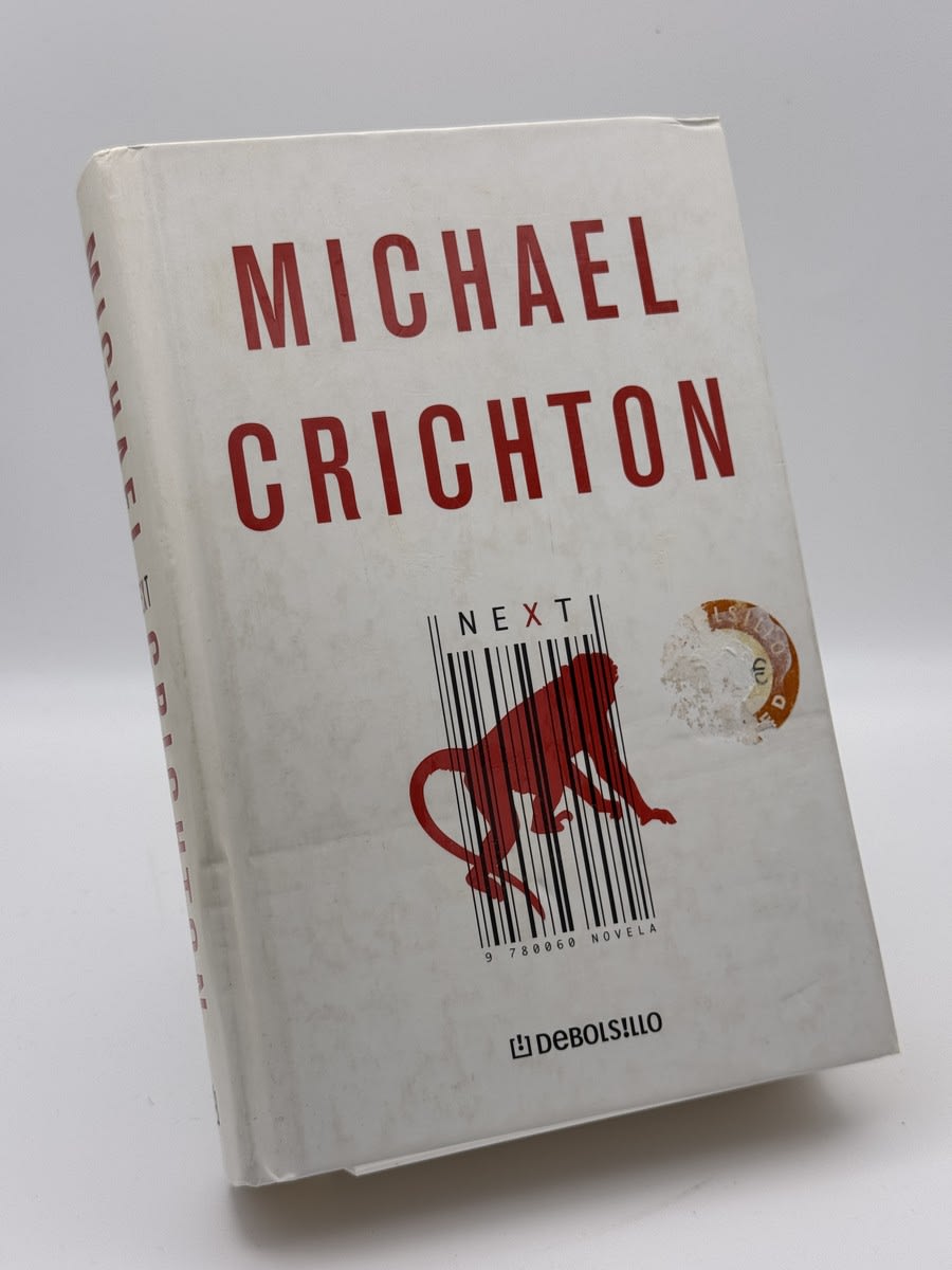 Portada de Next de Michael Crichton, libro de segunda mano